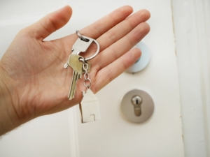 A hand holding house keys