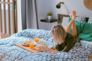 A woman having breakfast in bed