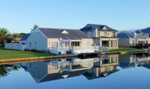 White Single-story houses next to a body of water